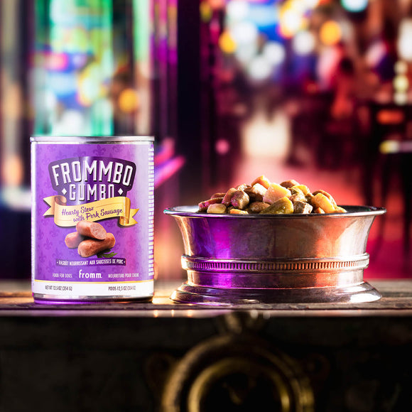Can of Frommbo Gima with a bowl of pet food on a blurred background