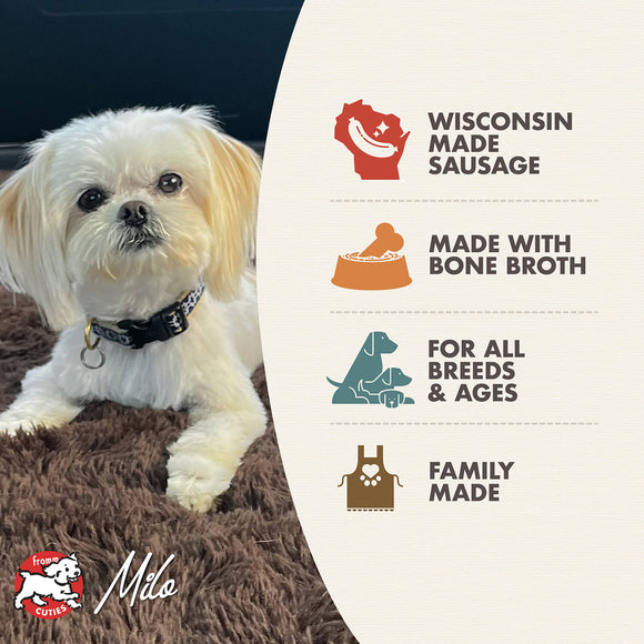 Dog lying on a brown blanket next to a product label for Wisconsin-made dog food with text about ingredients and production.