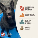 Black dog in a blue bowl with Aliche pet food branding and product features on the side.