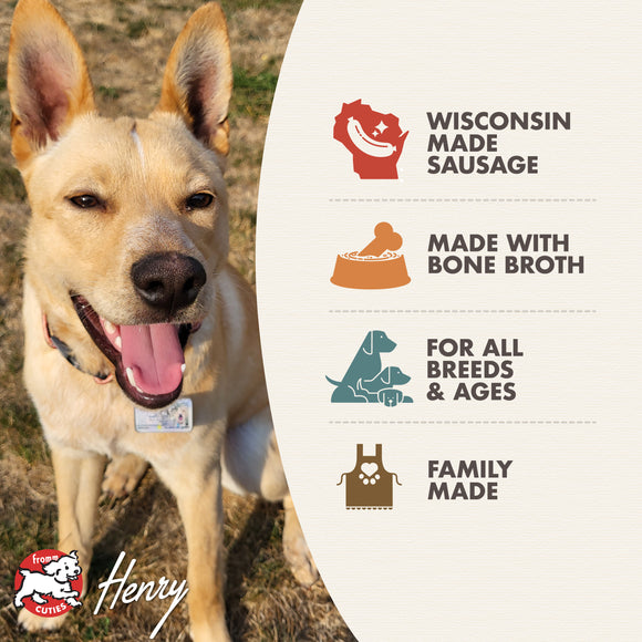 Dog standing next to a product label about Wisconsin-made sausage with bone broth, suitable for all breeds and ages.