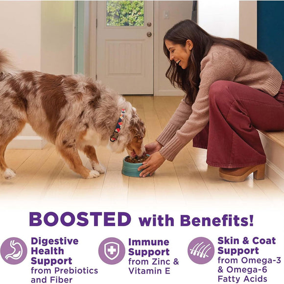 Woman feeding a dog from a bowl indoors, with text about pet food benefits.