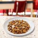 Plate of pet food on a table with a blurred background