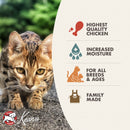 Cat on a stone surface with Keanu pet food packaging featuring product benefits.