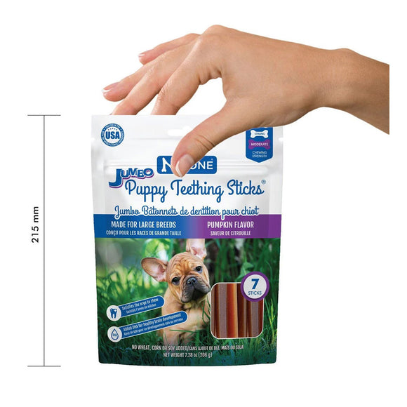 JUNO Puppy Teething Sticks packaging with a hand holding it, on a white background.