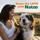 Woman with a dog in a field with 'Share the LOVE with Natoo' text overlay