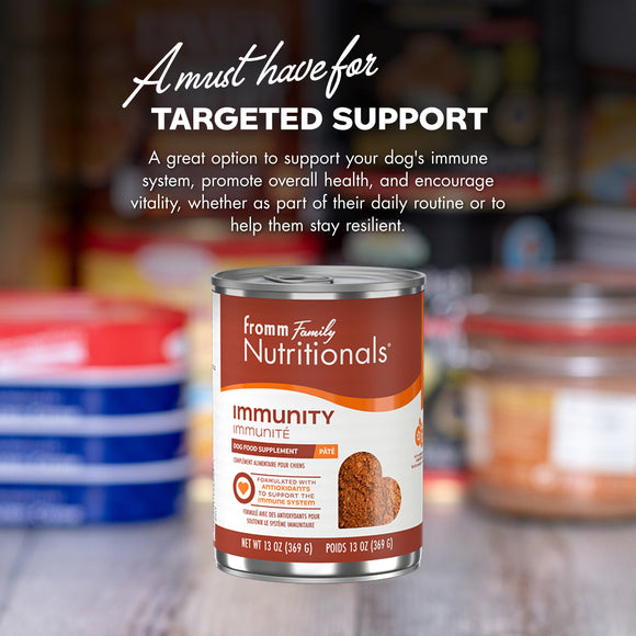 Can of 'from family Nutritionals' dog food on a blurred background with text about targeted support.