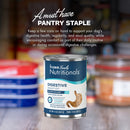Can of Fromm Family Nutritionals dog food with text about digestive health on a blurred pantry background.