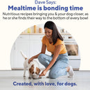 Woman in yellow shirt and blue jeans kneeling on a white floor with a dog, with text about mealtime bonding and nutritious recipes.
