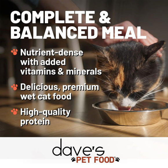 Cat drinking from a bowl with text about dave's pet food on a wooden surface.
