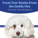 Advertisement for a tear stain treatment product with a white dog and text about treating tear stains.