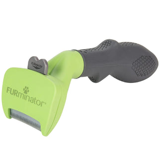 Green and black Furminator de-shedding tool for small dogs with short hair