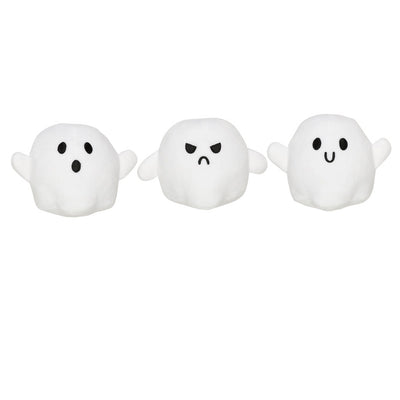 Three white ghost toys with different facial expressions on a white background