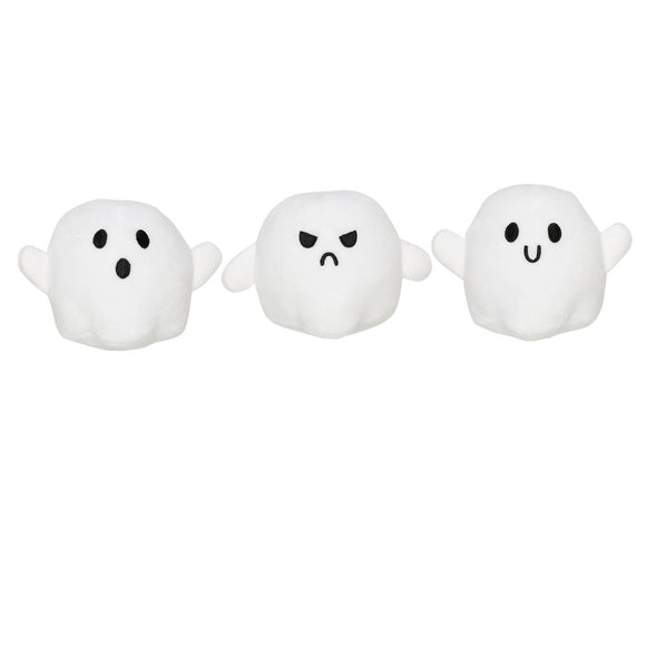 Three white ghost toys with different facial expressions on a white background