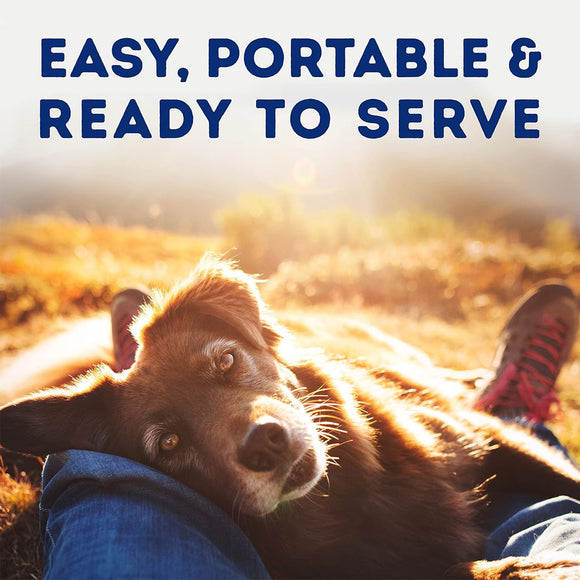 Dog lying on a person's lap with text 'Easy, Portable & Ready to Serve' in a field.