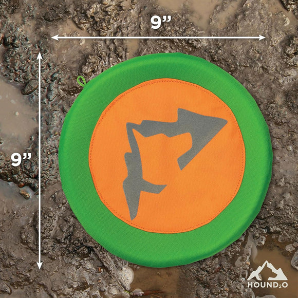 Green and orange disc with a dog icon on a textured surface