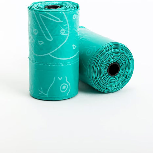 Two rolls of teal dog waste bags with white designs on a white background