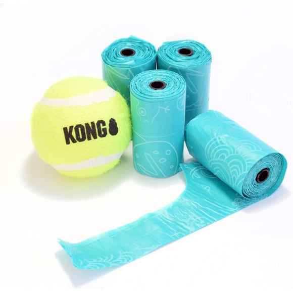 Yellow KONG tennis ball with blue rolls of dog training equipment on a white background