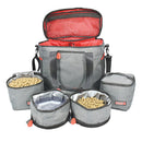 Gray pet travel bag with open lid and multiple compartments containing pet food.