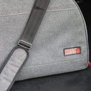Gray bag with a strap and KONG logo on a black background