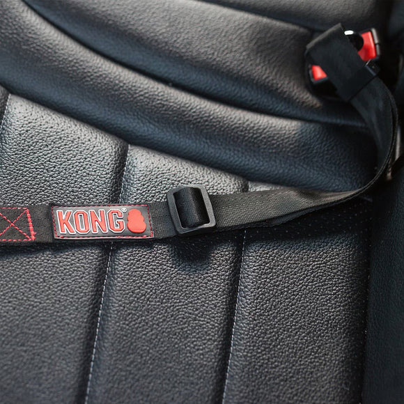 Close-up of a black leather bag with a strap featuring the 'KONG' logo.