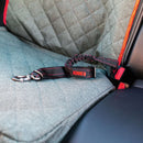 Kong dog leash attached to a car seat with a red accent