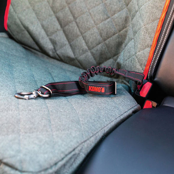 Kong dog leash attached to a car seat with a red accent
