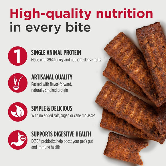 Dog treats with text highlighting high-quality nutrition, single animal protein, artisanal quality, simple & delicious, and digestive health benefits.