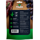 Nulo pet food package with ingredients and feeding guidelines on a wooden board.