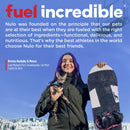 Person holding a cat and a snowboard with promotional text about Nulo pet food.