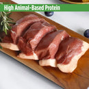 Raw meat on a wooden cutting board with rosemary, on a white background.