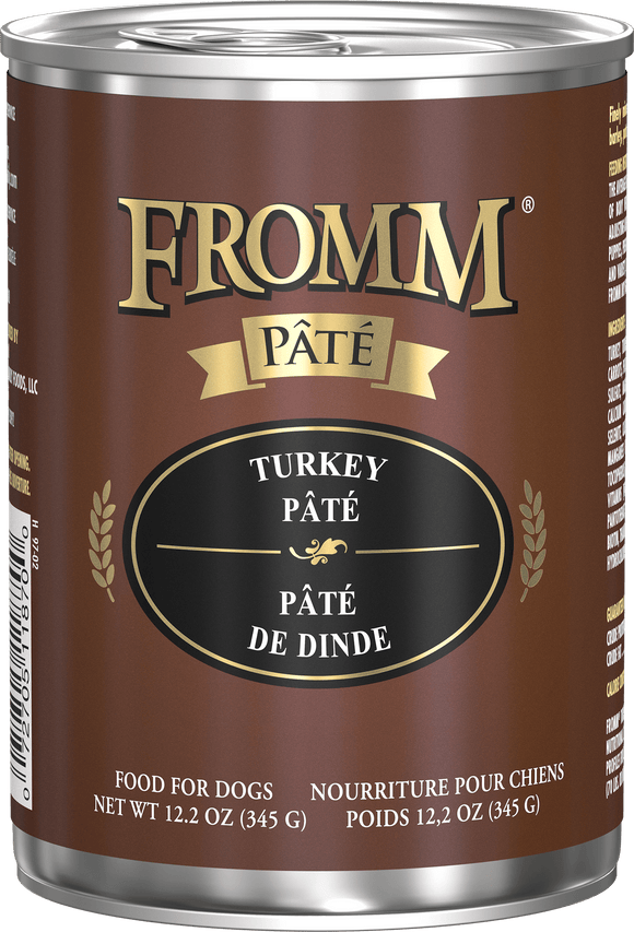 Can of Fromm Turkey Pété dog food on a black background
