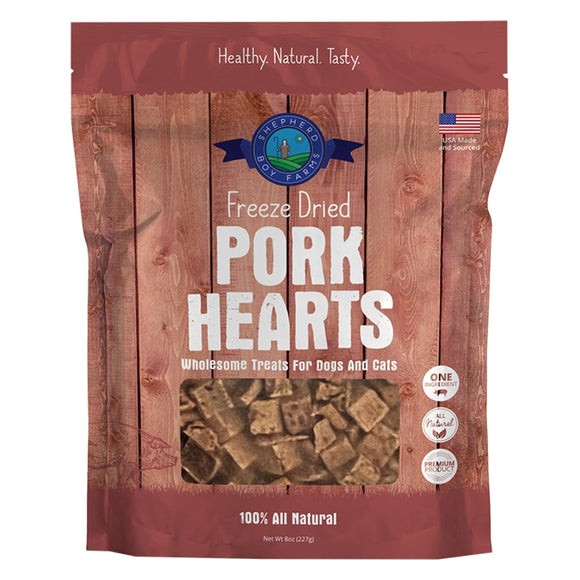Package of freeze-dried pork hearts for pets on a wooden background
