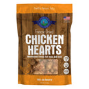 Package of freeze-dried chicken hearts treats for pets on a wooden background
