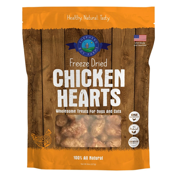 Package of freeze-dried chicken hearts for pets on a wooden background