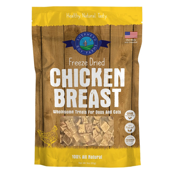 Package of freeze-dried chicken breast treats for pets on a wooden background