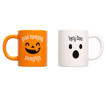 Two Halloween-themed mugs, one orange with a pumpkin face and text, the other white with a ghost face and text, on a white background.