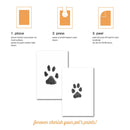 Instructions for using a paw print kit with two completed paw prints on cards.