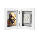 White double-sided frame with a photo of a dog and a paw print on a white background