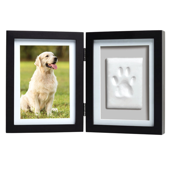 Black double frame with a photo of a dog on one side and a paw print on the other, on a white background.