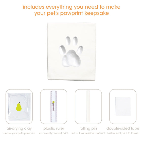 Pet pawprint keepsake kit with air-drying clay, plastic ruler, rolling pin, and double-sided tape on a white background.
