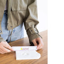 Person using a measuring tool with 'pearhead' branding on a wooden surface.