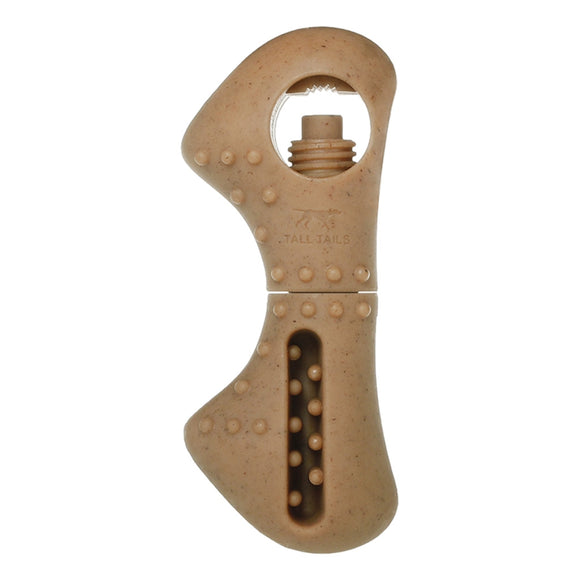 Beige dog chew toy with a central hole on a white background
