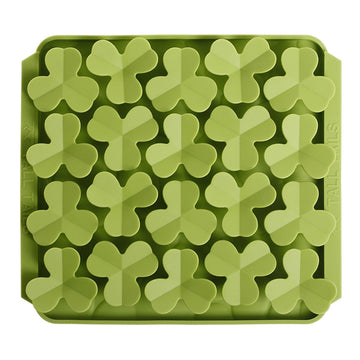 Green silicone mold with clover leaf shapes on a white background