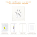 Pet pawprint keepsake kit with air-drying clay, plastic ruler, rolling pin, and double-sided tape on a white background.