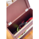 Brown wooden storage box with a tennis ball and red object inside, on a wooden floor.