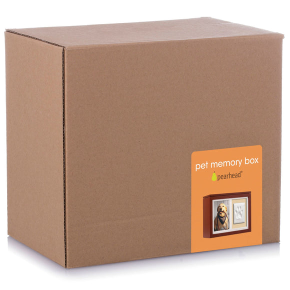 Brown cardboard box with Pearhead pet memory box label on a white background