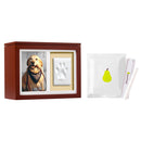 Wooden photo box with a dog picture, white plaque, and small white card with a green pear on a white background.
