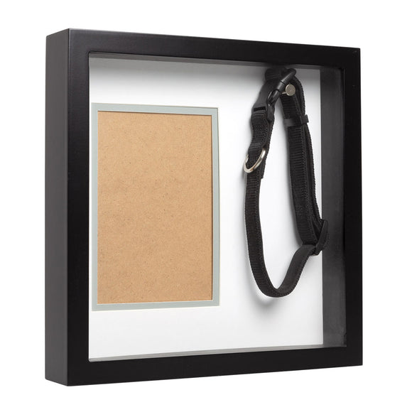 Black shadow box with a photo frame and black dog collar inside
