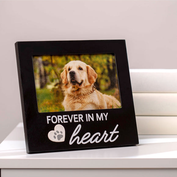 Black photo frame with a dog picture and 'Forever in my heart' text on a white surface.