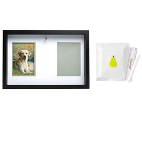 Framed artwork of a dog with a pear illustration on a white background